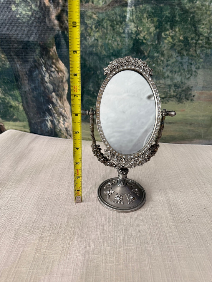 Ornate oval tabletop vanity mirror