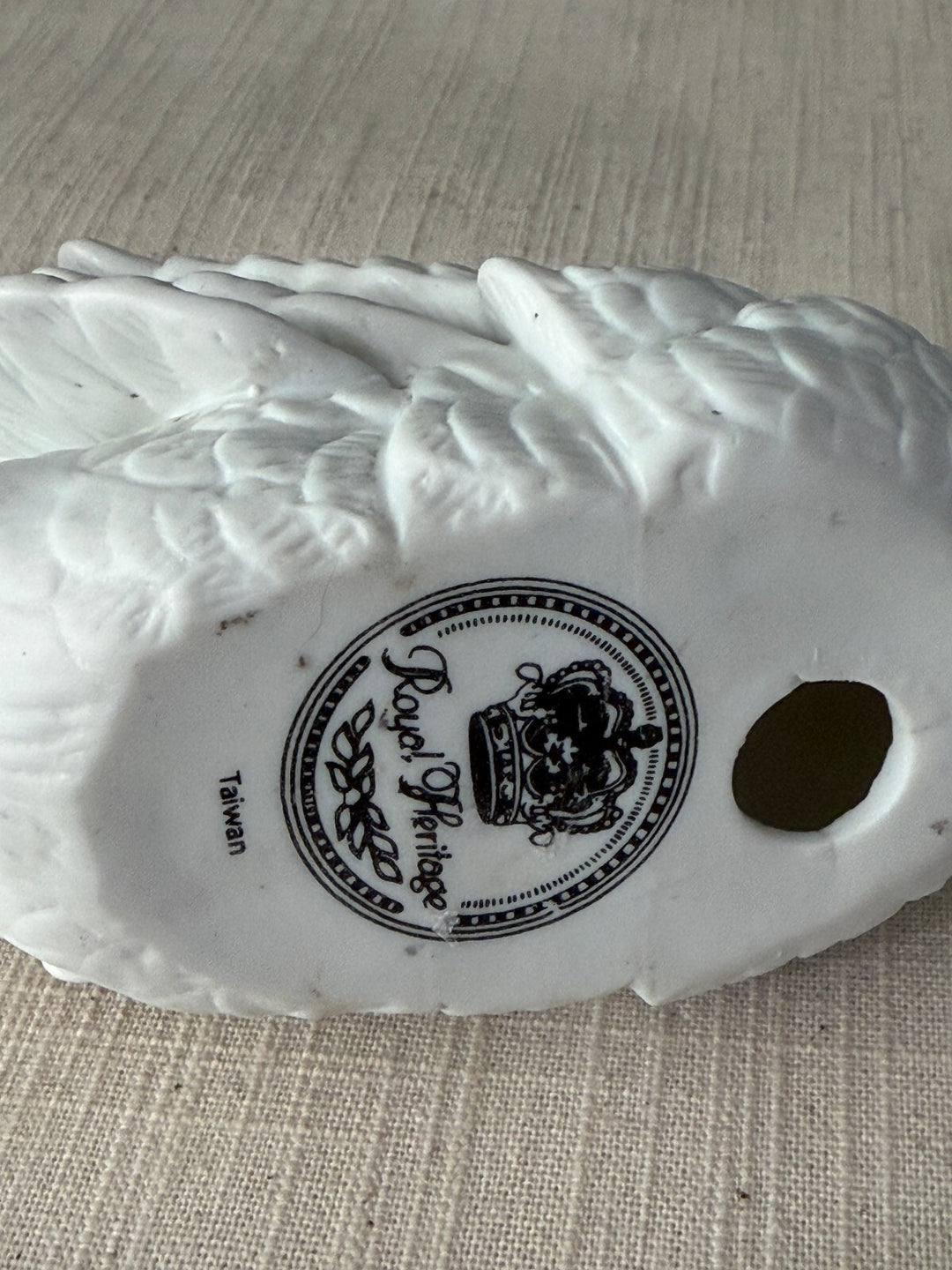 Small white porcelain swan figurine