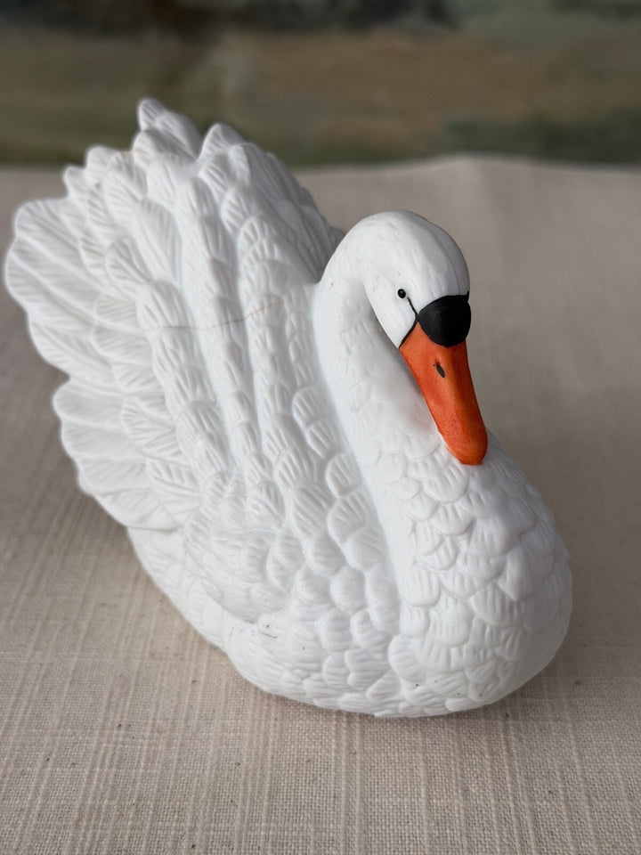 Small white porcelain swan figurine