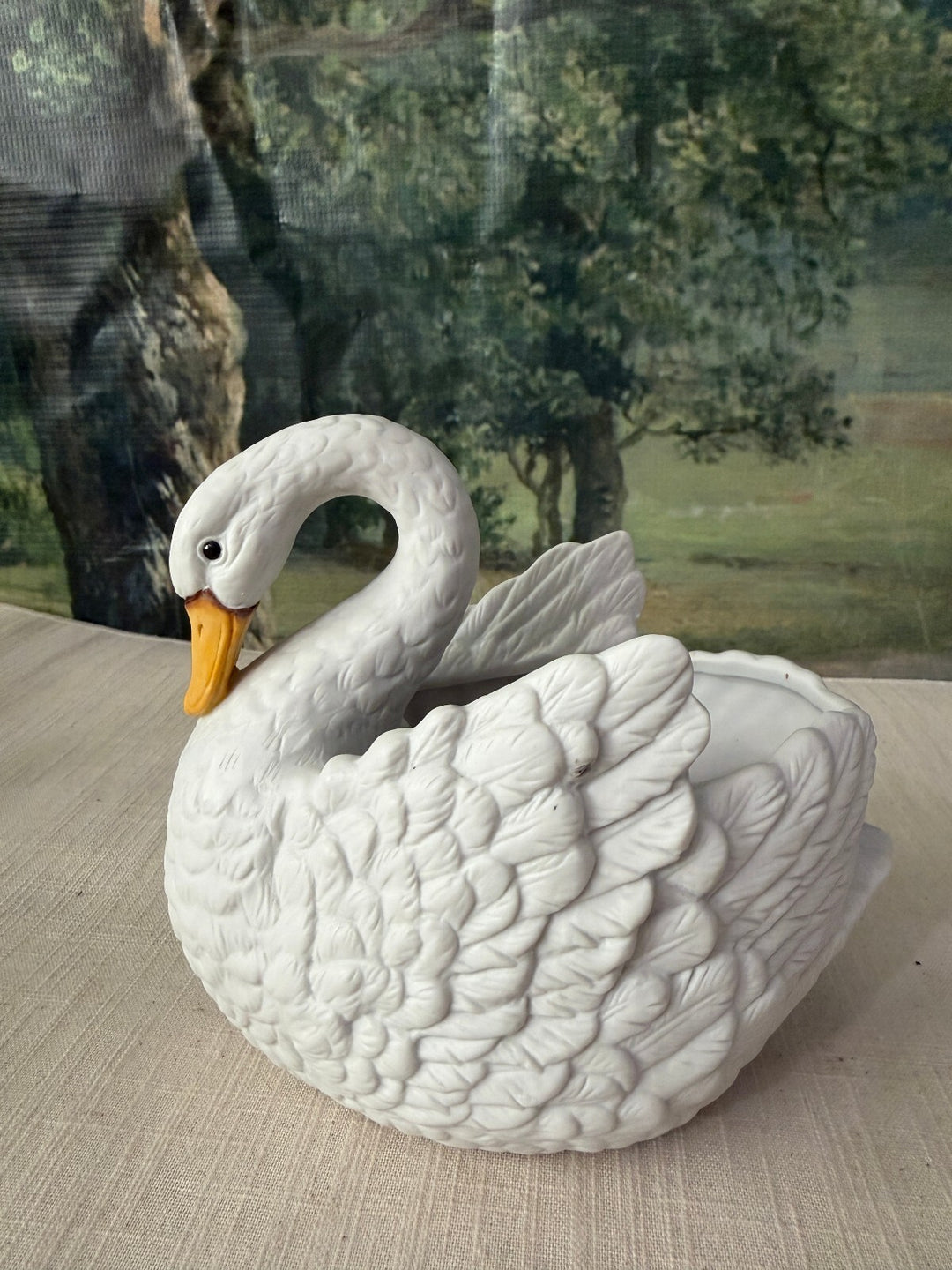 White ceramic swan planter