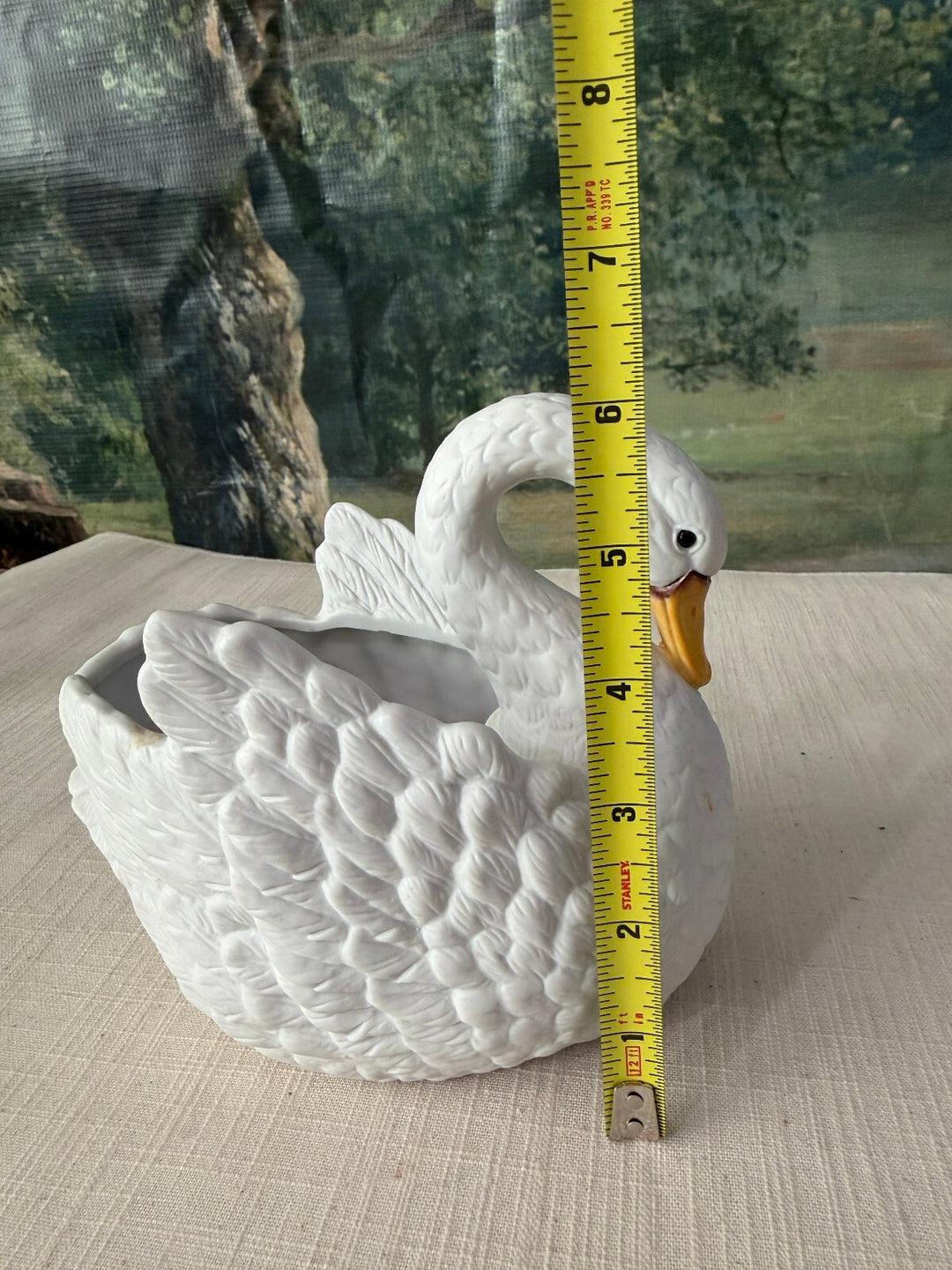 White ceramic swan planter