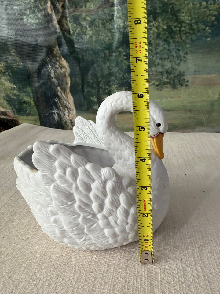 White ceramic swan planter