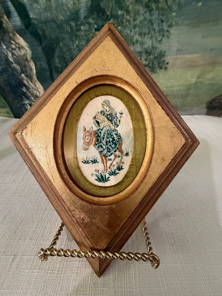 Diamond shaped wood frame with bird oval insert
