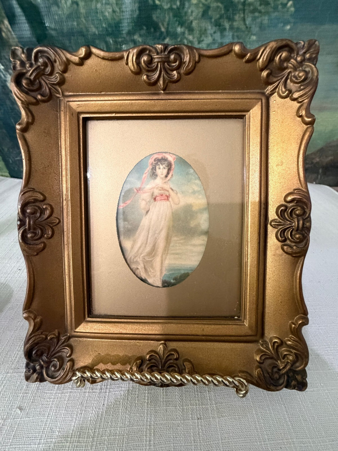 Ornate gold framed angel print