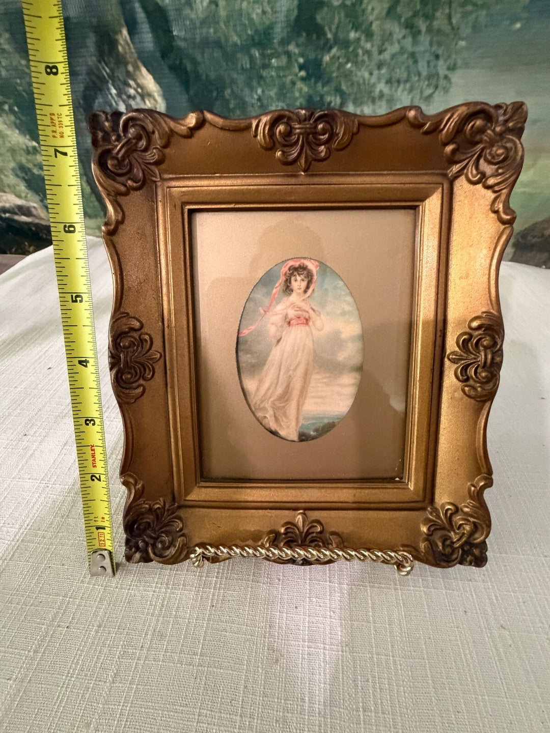 Ornate gold framed angel print