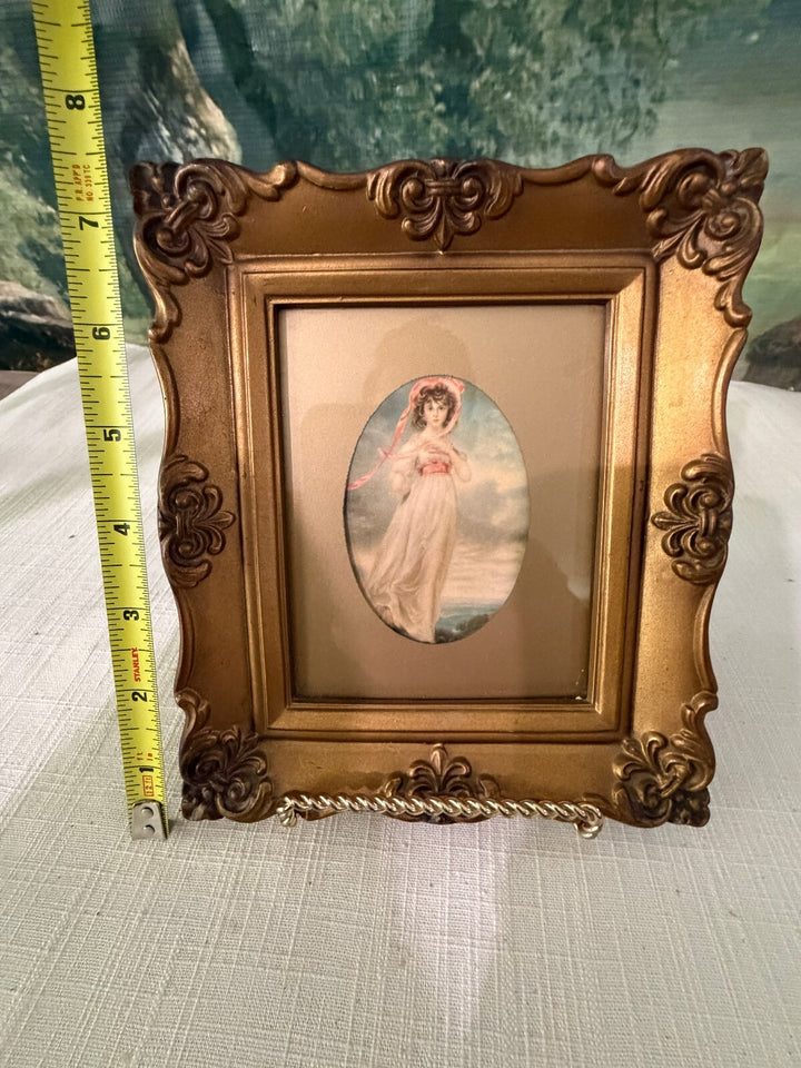 Ornate gold framed angel print