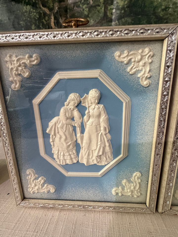 Blue and white relief wall plaques set of 2