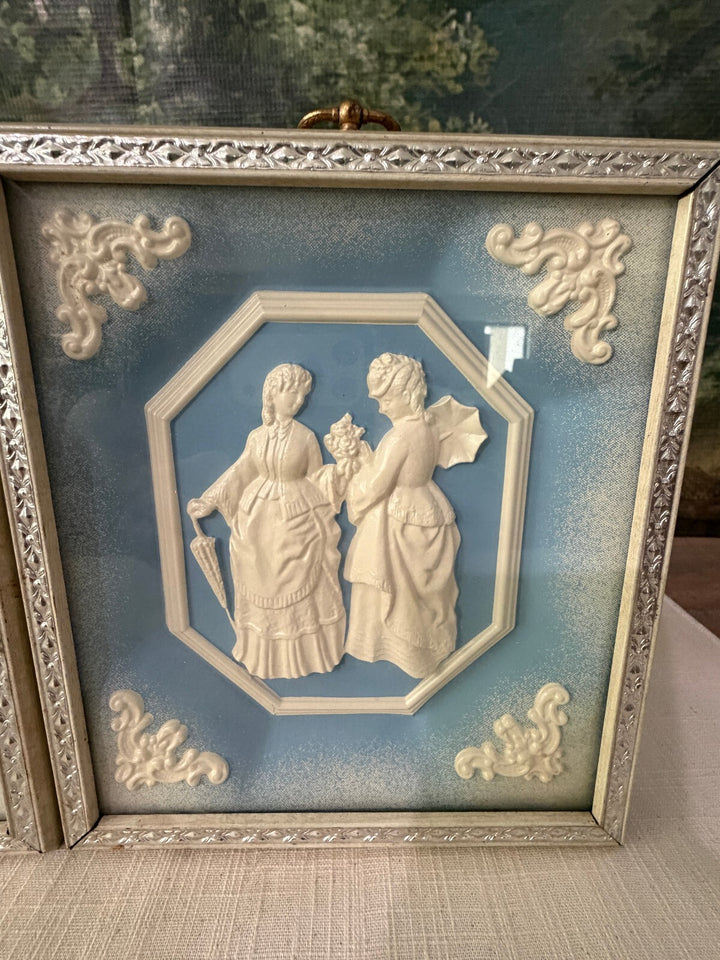 Blue and white relief wall plaques set of 2