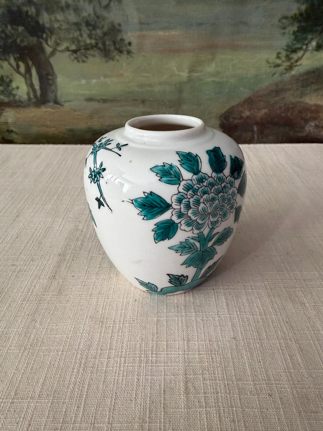White ceramic vase with floral design