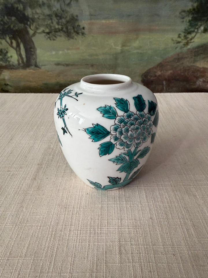 White ceramic vase with floral design