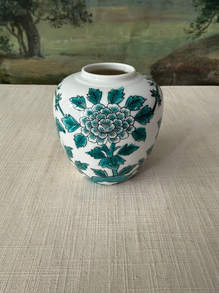 White ceramic vase with floral design