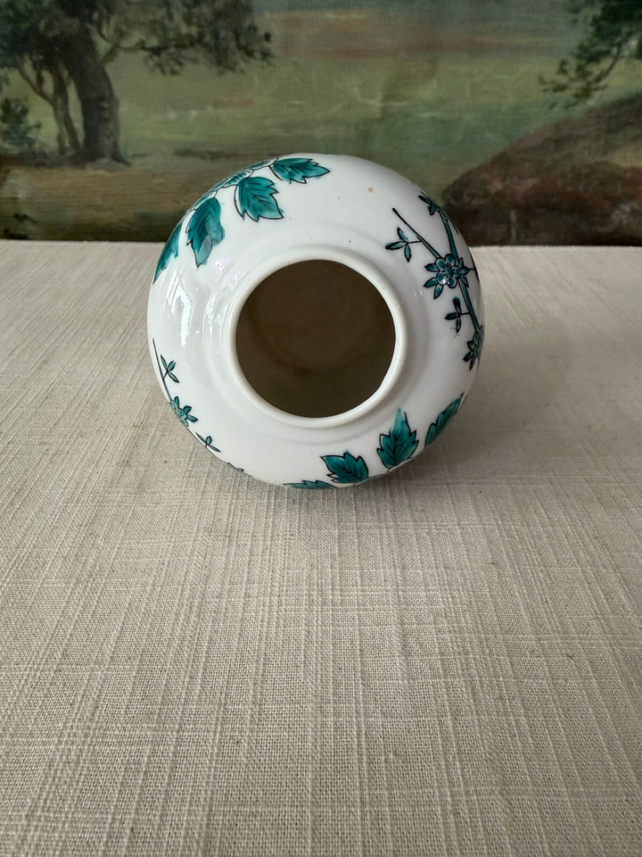 White ceramic vase with floral design