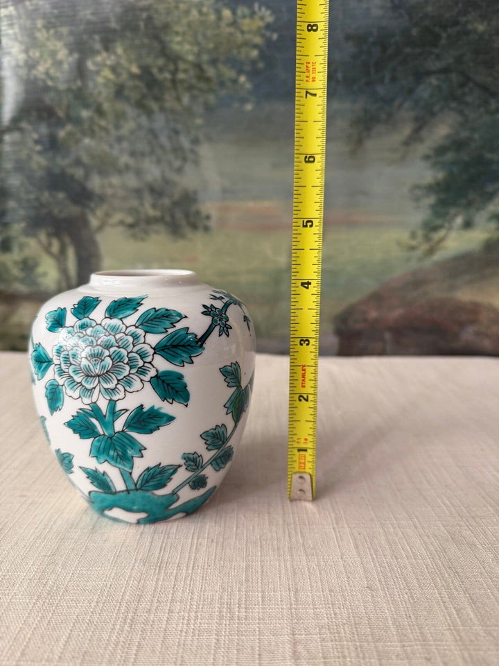 White ceramic vase with floral design