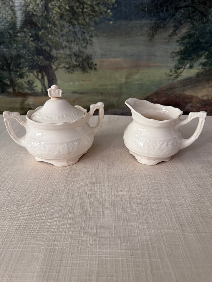 White ceramic sugar bowl and creamer set