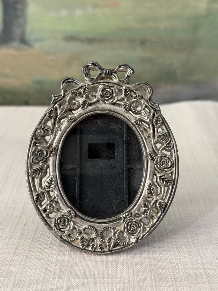Vintage Silver Tone Oval Photo Frame with Floral and Bow Design